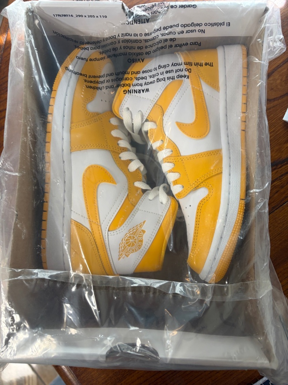 Nike Air Jordan 1 Mid White and Yellow Trainers
